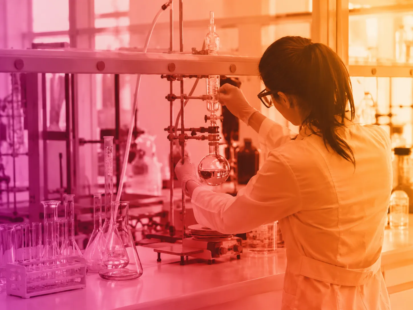 Chemist performing custom organic synthesis in the laboratory